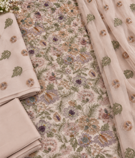 Closeup of cotton net fabric with multicolor handmade floral embroidery