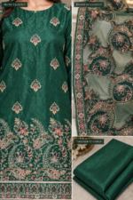 Closeup of emerald green Sheesha Silk shirt embroidered net dupatta and trouser fabric