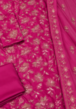 Magenta silk unstitched fabric with detailed floral embroidery closeup