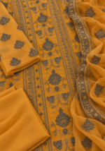 Mustard orange chiffon fabric with handwork embroidery closeup