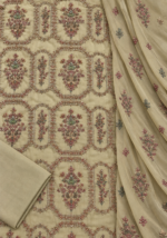 Closeup of sage olive silk fabric with detailed floral handwork