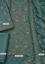 Closeup of teal green chiffon fabric with handmade embroidery and beadwork