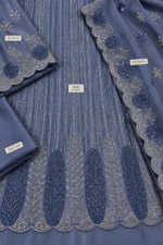 Blue Sheesha Silk unstitched fabric with cut dana work closeup