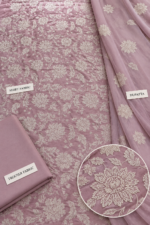 Close up of dusty mauve silk fabric with ivory floral embroidery and matching chiffon dupatta