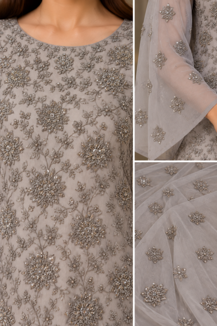 Close up of grey chiffon suit with detailed silver floral embroidery and sheer fabric