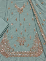 Mint green silk unstitched fabric with handmade embroidery closeup